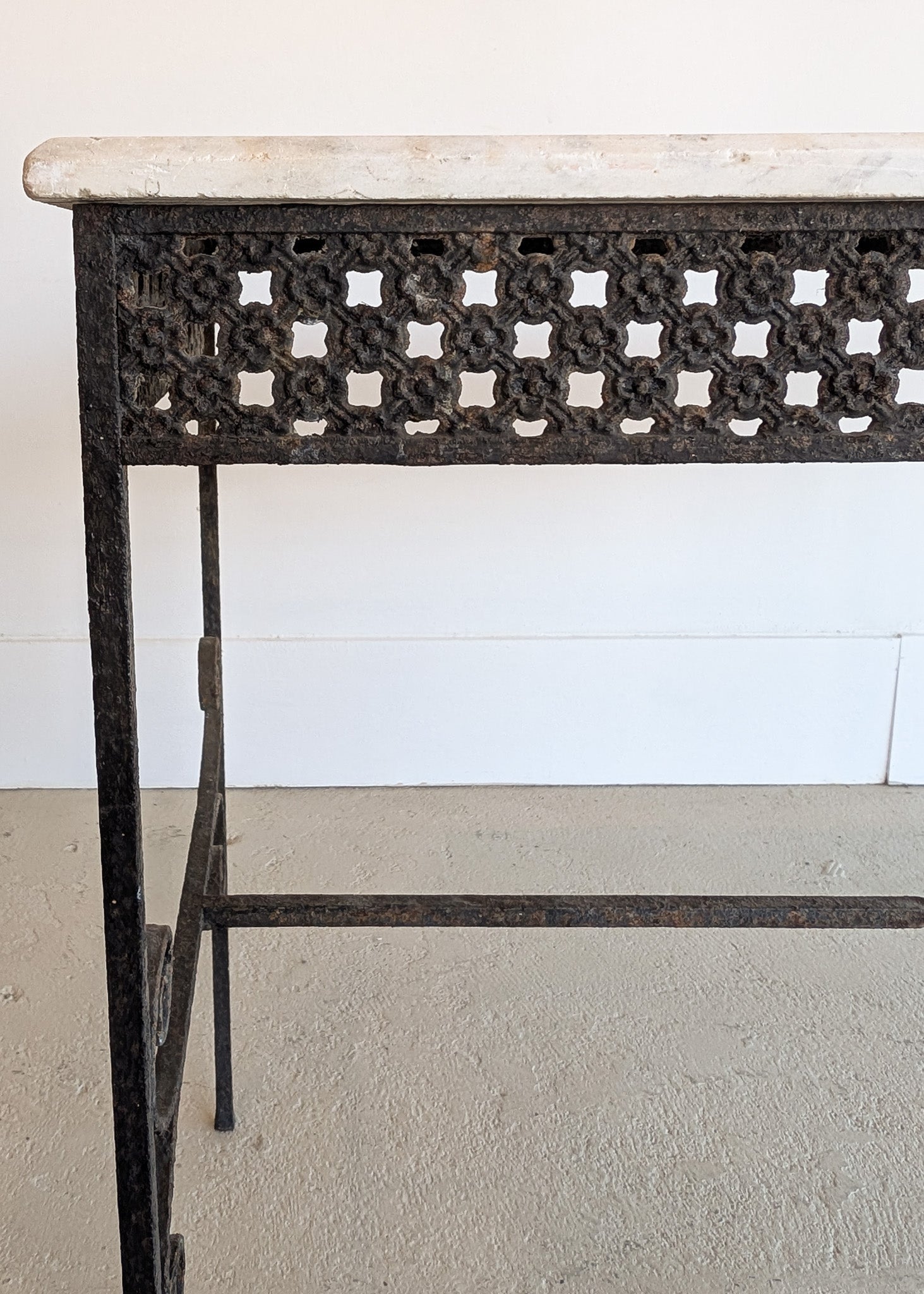 Antique French Marble-Top Console Table with Wrought Iron Base and Quatrefoil Apron and Scroll Detailing