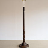 Six-Foot-Tall Antique European Charles Dudouyt-Style Wooden Oak Two-Light Spindle Floor Lamp with Bell-Shaped Base and Ball Feet
