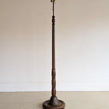 Six-Foot-Tall Antique European Charles Dudouyt-Style Wooden Oak Two-Light Spindle Floor Lamp with Bell-Shaped Base and Ball Feet
