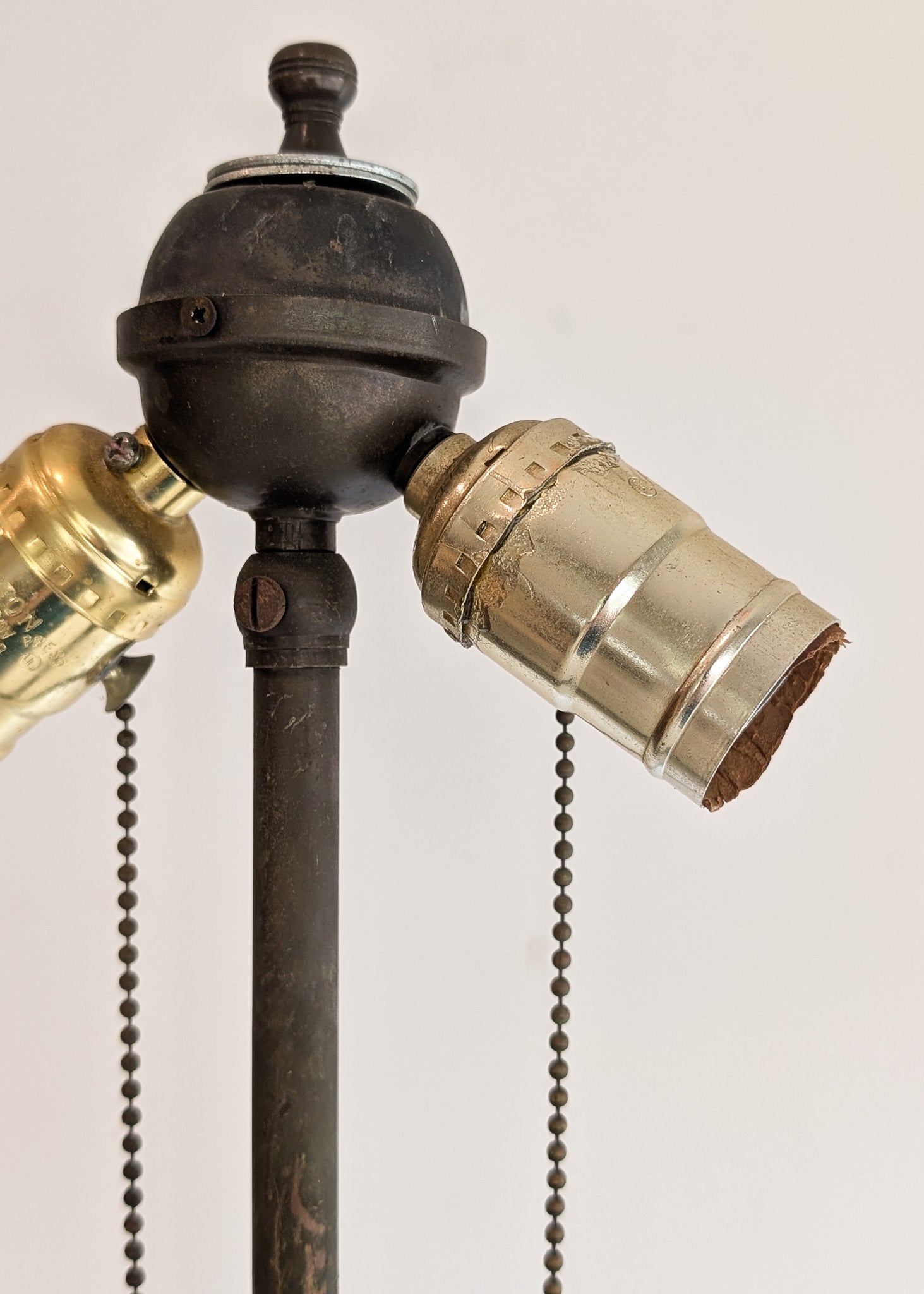 Six-Foot-Tall Antique European Charles Dudouyt-Style Wooden Oak Two-Light Spindle Floor Lamp with Bell-Shaped Base and Ball Feet