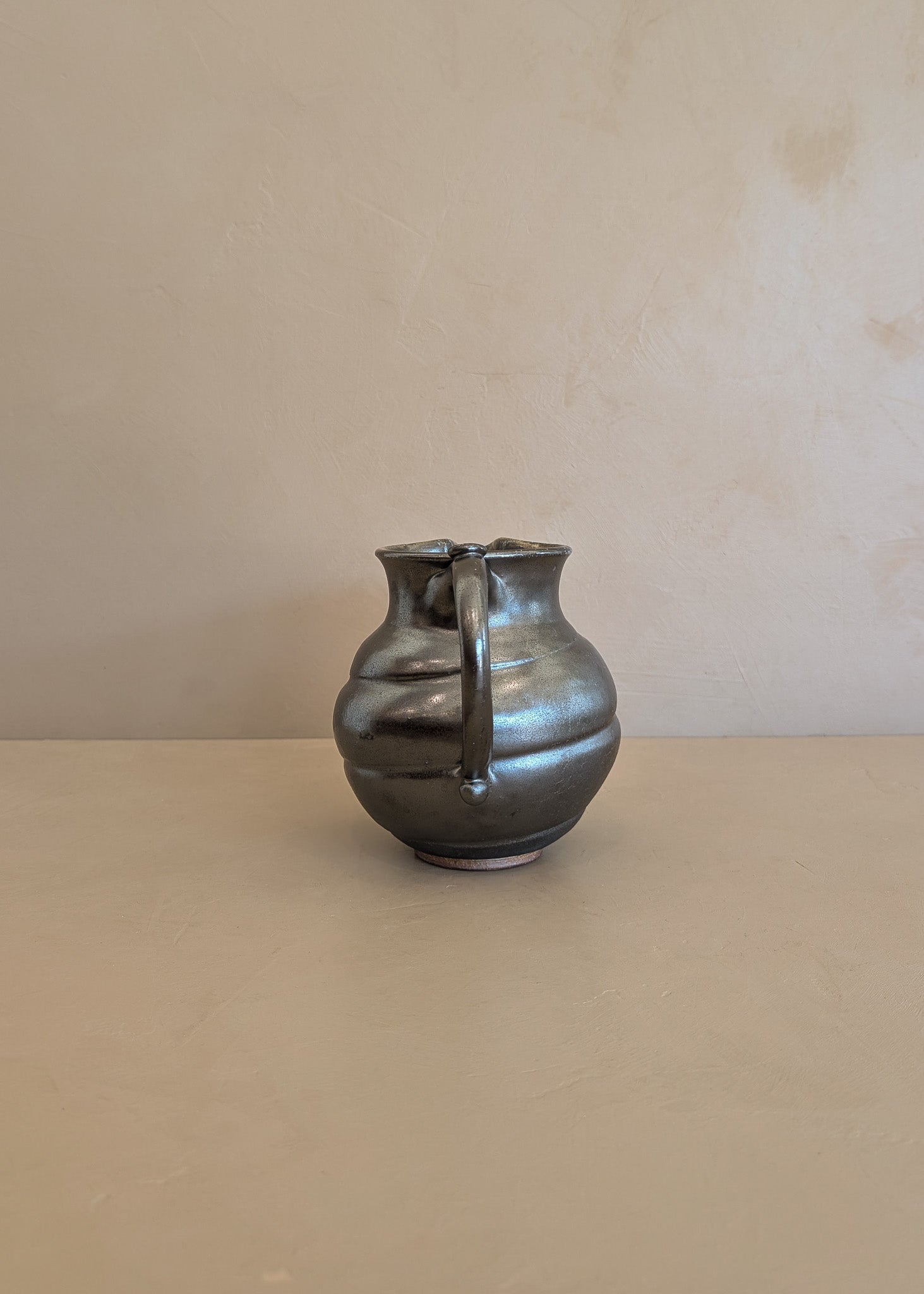 Dark Metallic-Glazed Studio Pottery Pitcher with Swirled Detailing