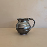 Dark Metallic-Glazed Studio Pottery Pitcher with Swirled Detailing