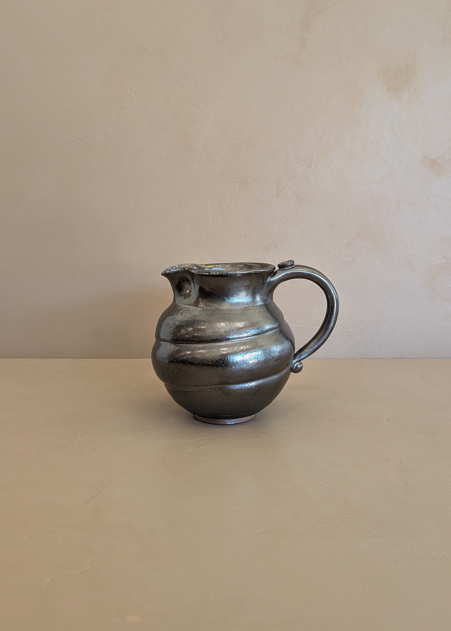 Dark Metallic-Glazed Studio Pottery Pitcher with Swirled Detailing