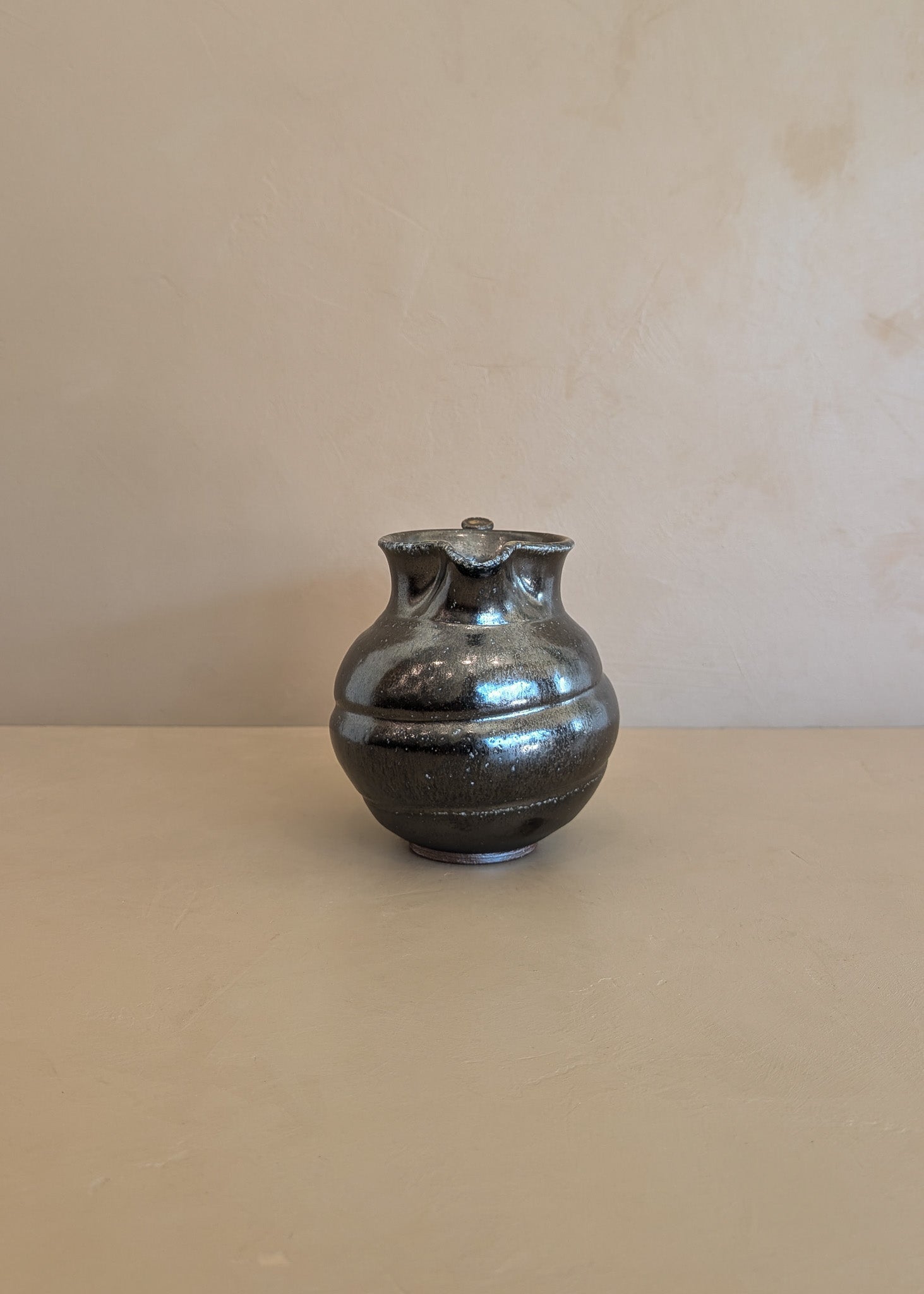 Dark Metallic-Glazed Studio Pottery Pitcher with Swirled Detailing