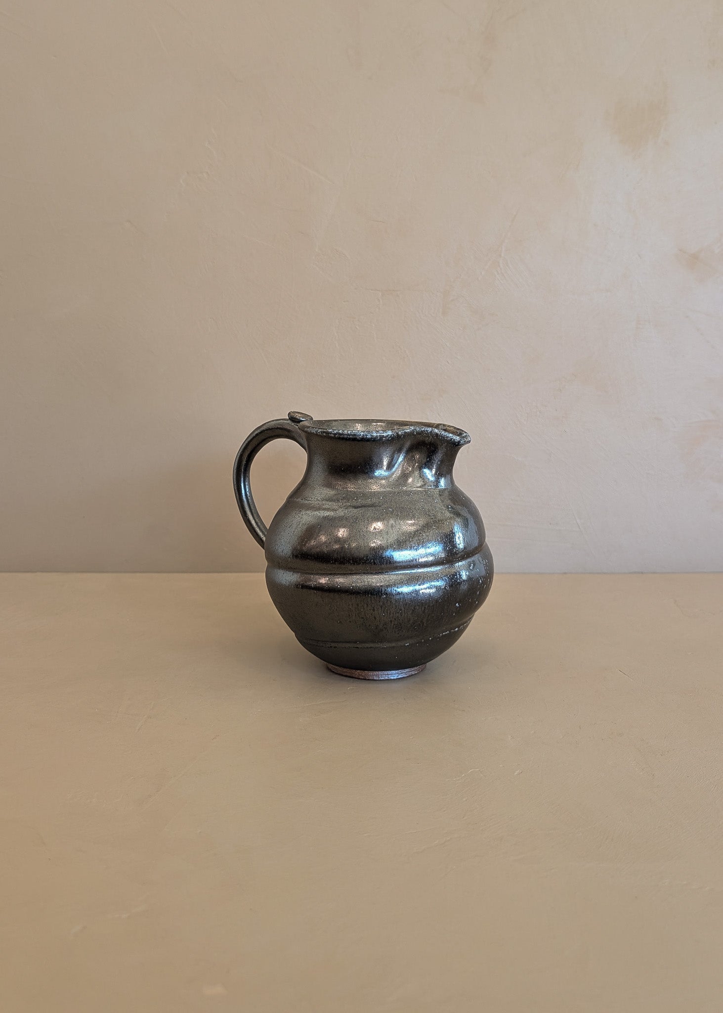 Dark Metallic-Glazed Studio Pottery Pitcher with Swirled Detailing