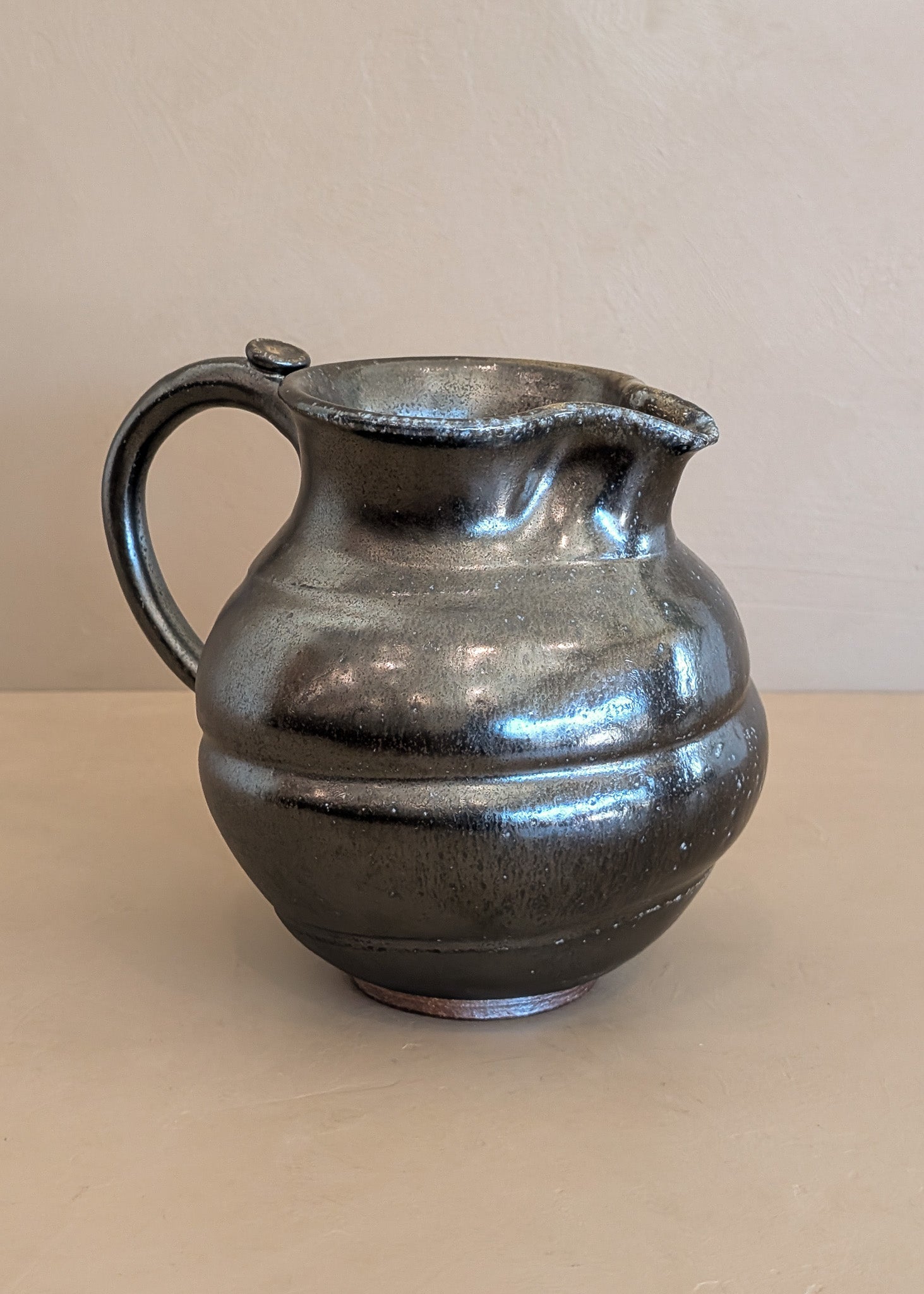 Dark Metallic-Glazed Studio Pottery Pitcher with Swirled Detailing