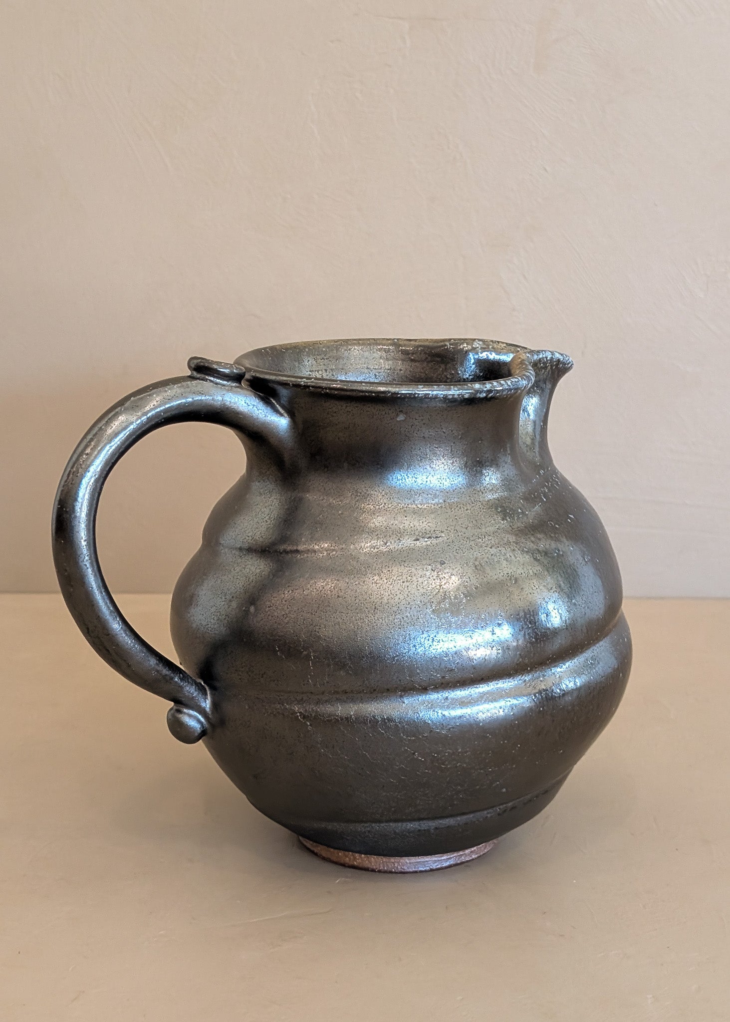 Dark Metallic-Glazed Studio Pottery Pitcher with Swirled Detailing